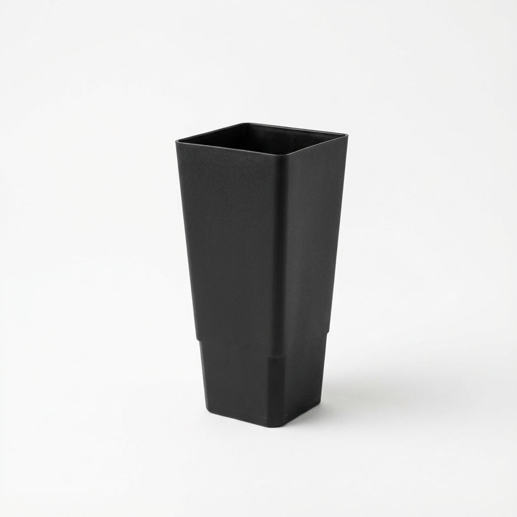 A Black Growers Plant Tube - 50mm, featuring a tall, matte black, square design, is shown against a plain white background.