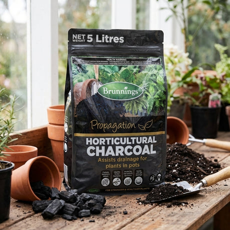A Brunnings 5L Horticultural Charcoal bag on a table, ideal for gardeners looking to boost plant health and improve drainage.
