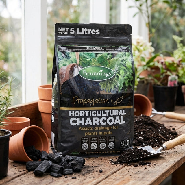 A Brunnings 5L Horticultural Charcoal bag on a table, ideal for gardeners looking to boost plant health and improve drainage.