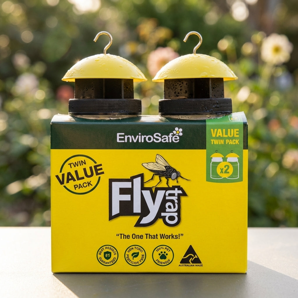 EnviroSafe Fly Trap - 2 Pack, a chemical-free fly control solution in yellow-green packaging, shown outdoors with a blurred garden background.