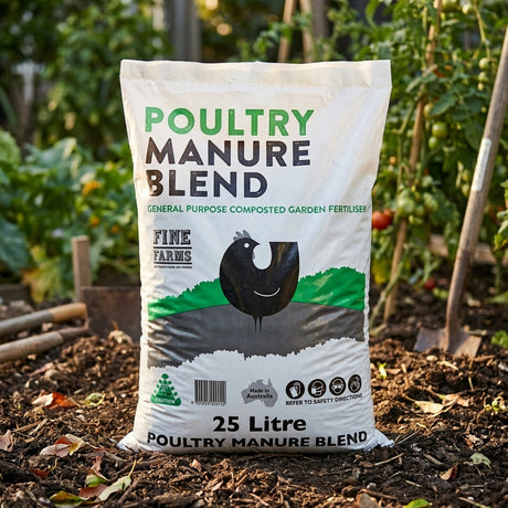 A Fine Farms 25L Blended Poultry Manure bag rests on garden soil, surrounded by plants, offering a high-quality composted fertiliser to enhance soil health.