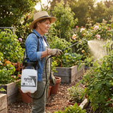 Wearing a hat, a woman uses Yates 200ml Zero Rapid Gel 1 Hour Action Weed Killer to target weeds in her garden on a sunny day.