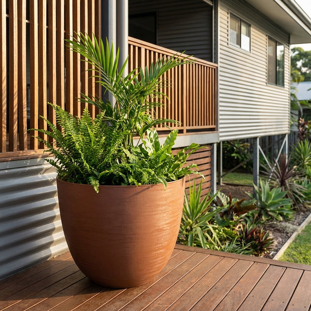The Terracotta Milano Self Watering Planter, available in various sizes and crafted in Italy, adds timeless style and lush greenery to your outdoor space.