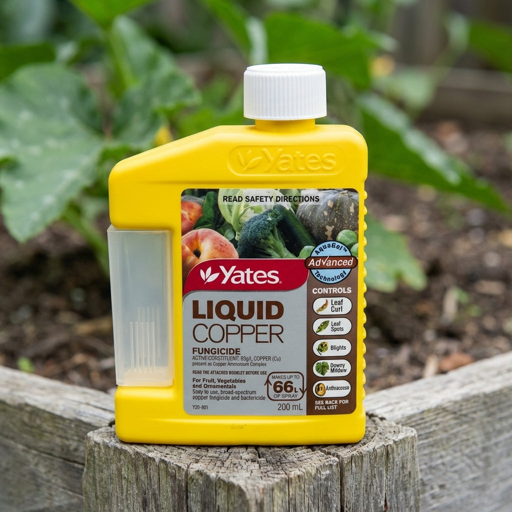 A 200ml bottle of Yates Liquid Copper Fungicide rests on a garden bed with plants in the background, ready to offer broad-spectrum protection against common fungal diseases.