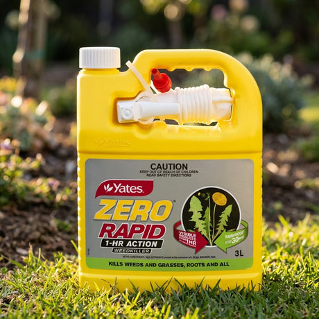 A yellow 3L Yates Ready To Use Zero Rapid 1 Hour Action Weed Killer sits on grass, sunlight shining on the bottle. This fast-acting weed killer tackles unwanted weeds quickly and effectively.